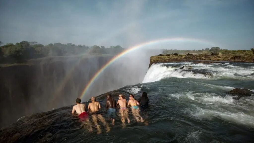 people-at-devils-pool-in-zambia-livingstone