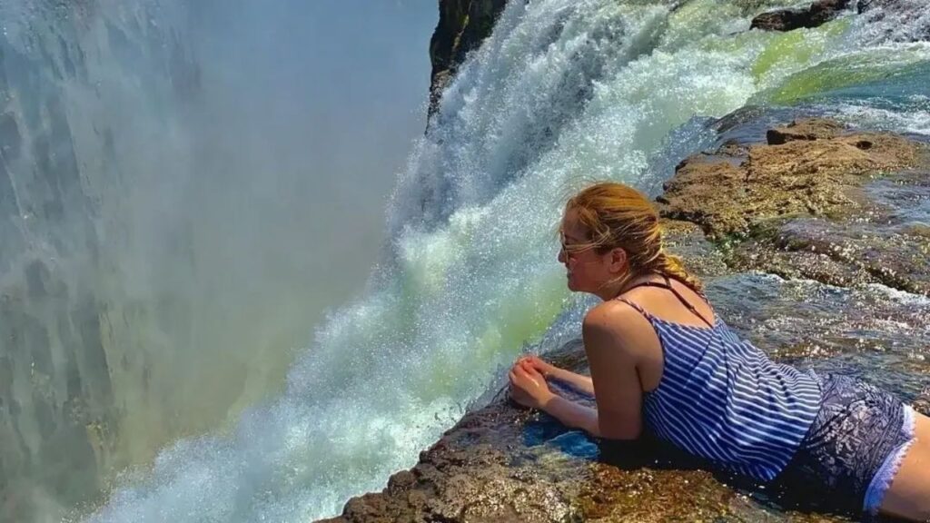 person-laying-on-devils-pool