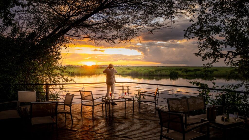 person-standing-on-the-deck-of-chobe-safari-lodge