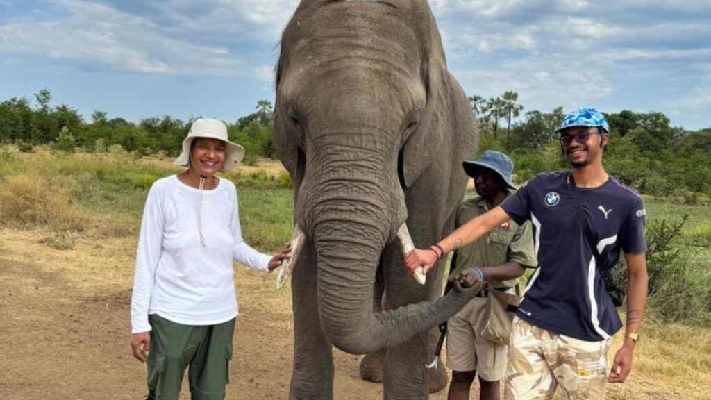 people-posing-with-elephant